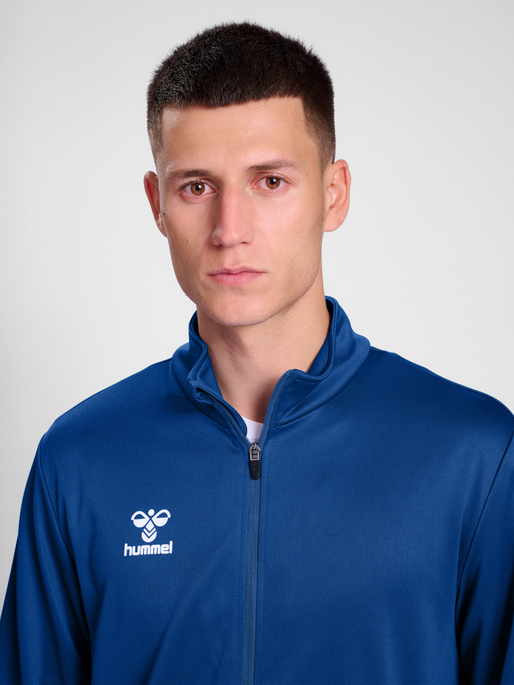 hmlESSENTIAL TRACK JACKET, TRUE BLUE, model