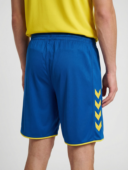 hmlCORE 2.0 SHORTS, TRUE BLUE/BLAZING YELLOW, model